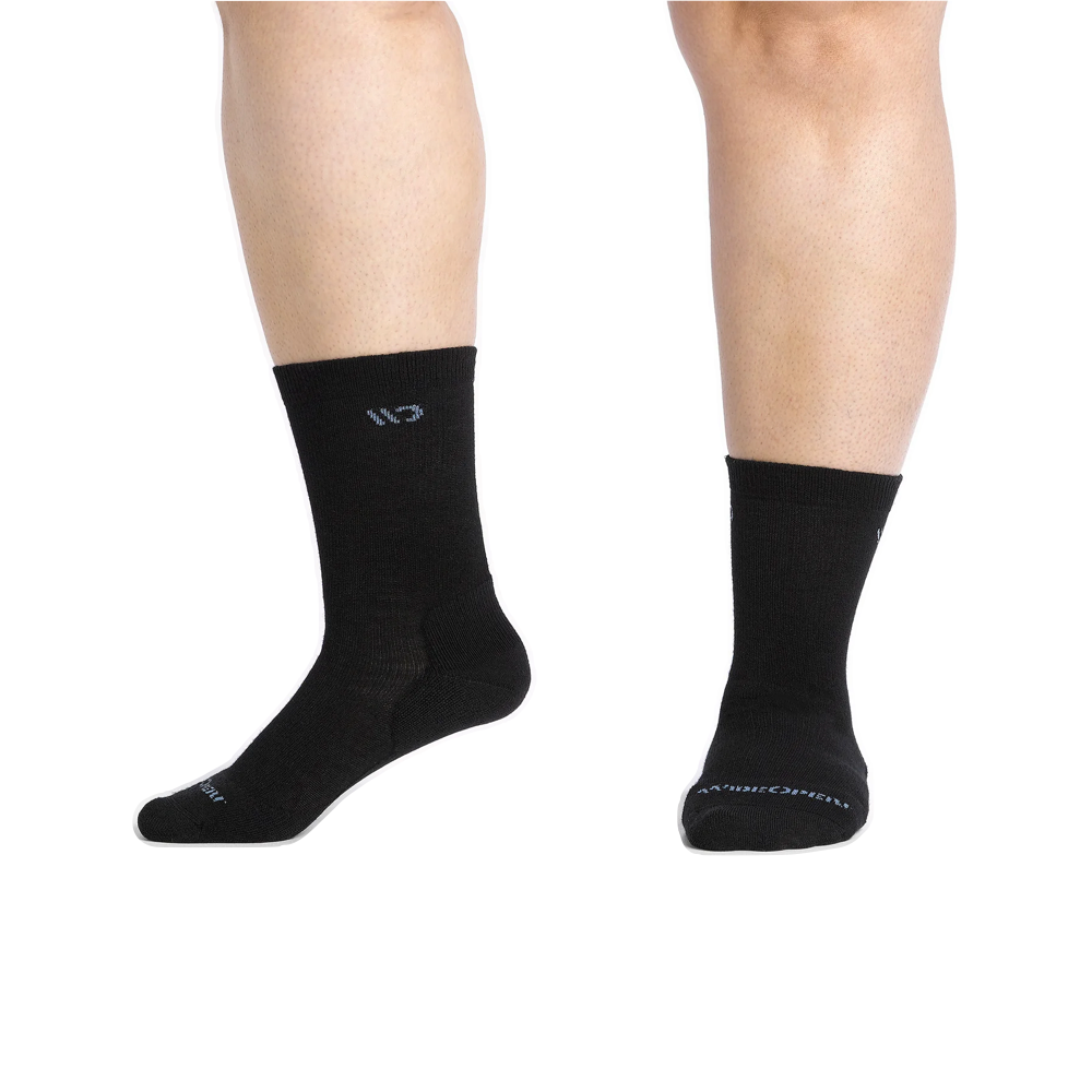 Model view of Wide Open by Darn Tough Solid Cushioned Crew Socks for women.