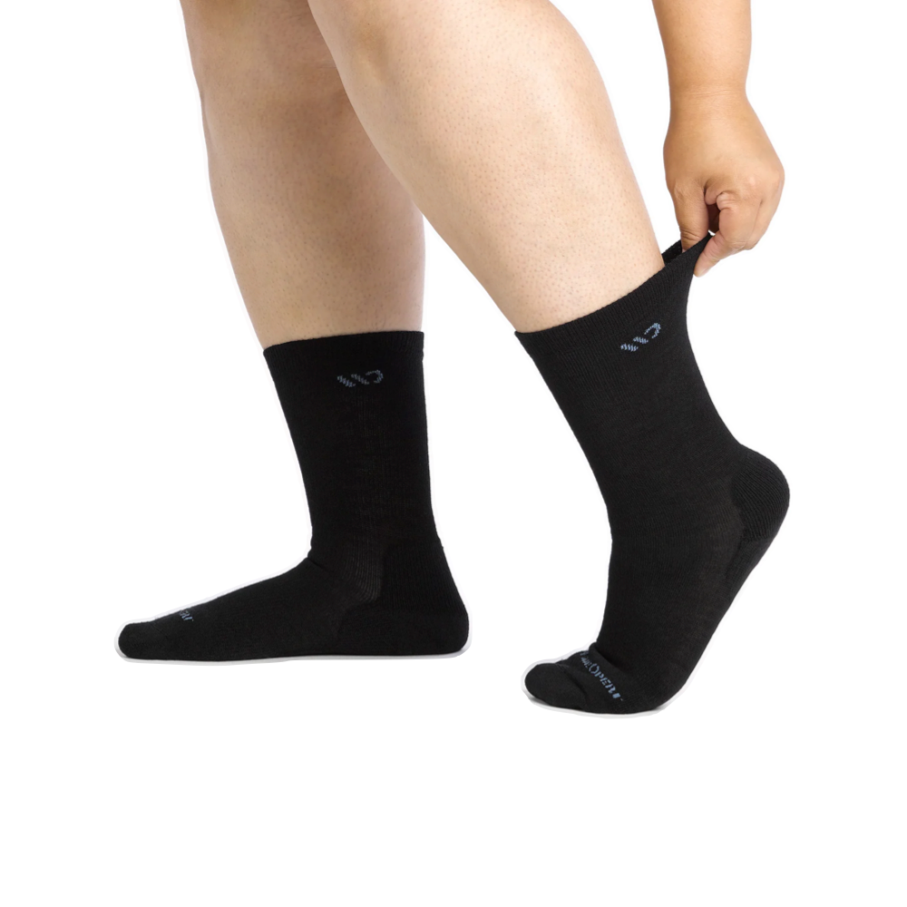 Model view of Wide Open by Darn Tough Solid Cushioned Crew Socks for women.