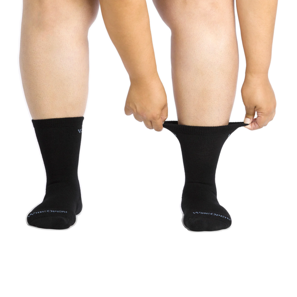 Model (front) view of Wide Open by Darn Tough Solid Cushioned Crew Socks for women.