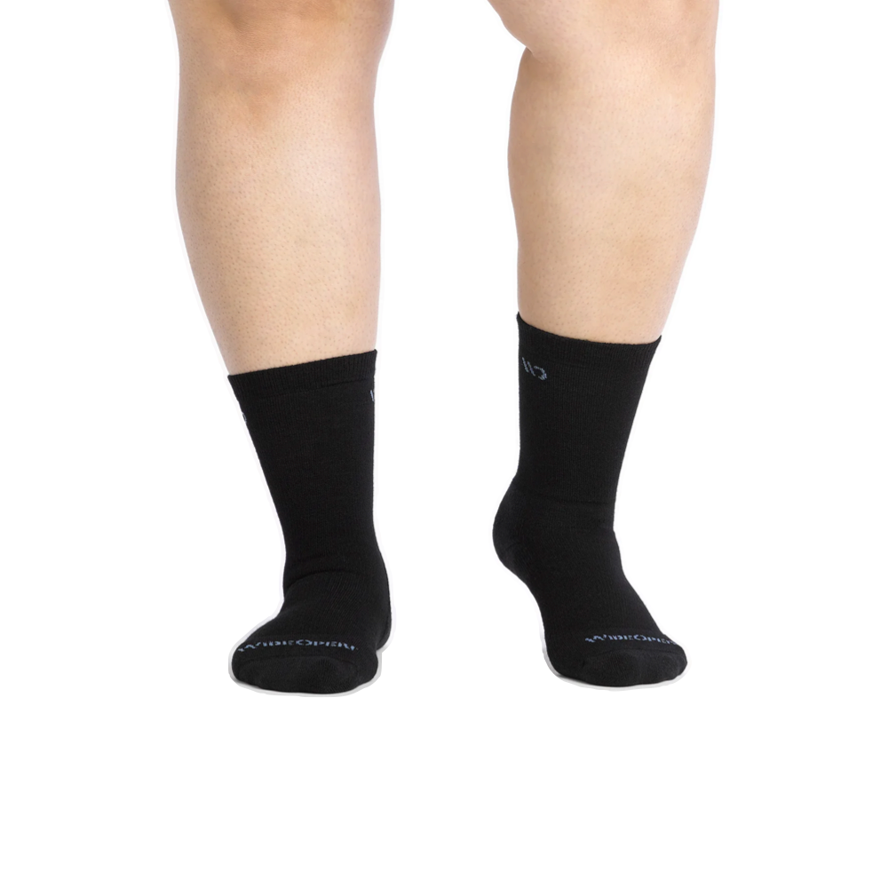 Model view of Wide Open by Darn Tough Solid Cushioned Crew Socks for women.