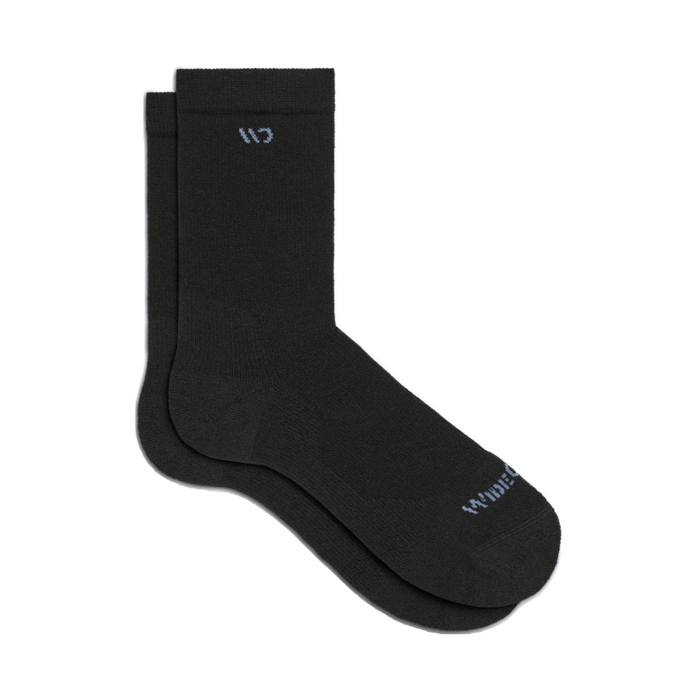 Side (right) view of Wide Open by Darn Tough Solid Cushioned Crew Socks for women.