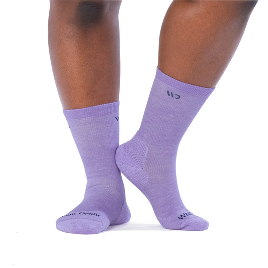 Model view of Wide Open by Darn Tough Solid Cushioned Crew Socks for women.