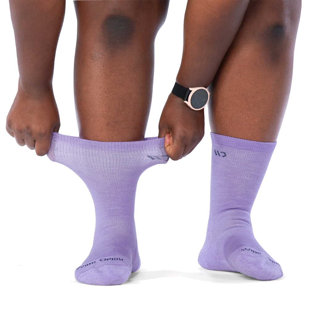 Front model view of Wide Open by Darn Tough Solid Cushioned Crew Socks for women.
