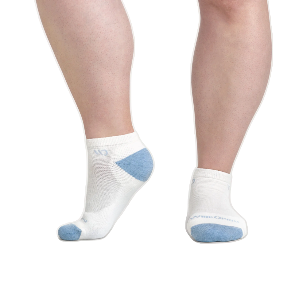 Model view of Wide Open by Darn Tough Solid Cushioned No Show Socks for women.
