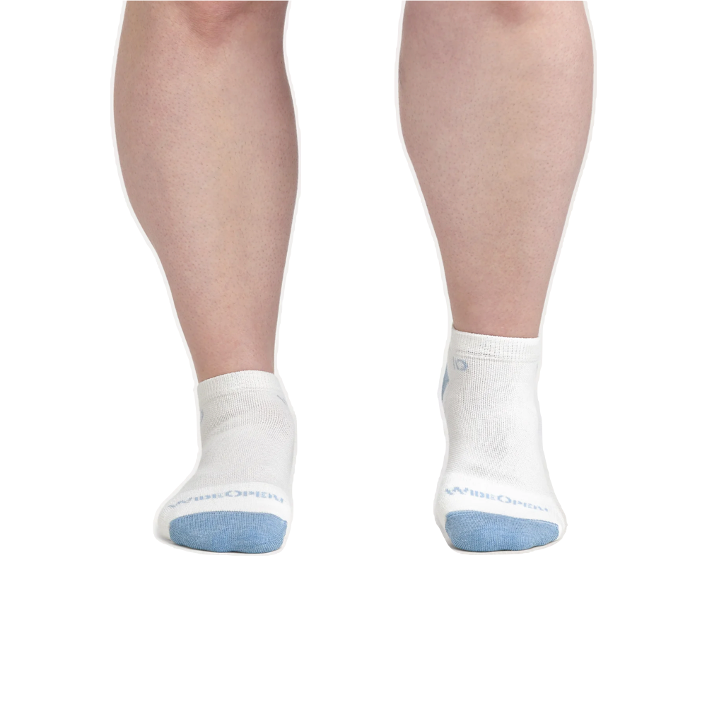 Model view of Wide Open by Darn Tough Solid Cushioned No Show Socks for women.