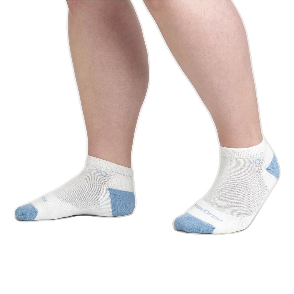 Model side view of Wide Open by Darn Tough Solid Cushioned No Show Socks for women.