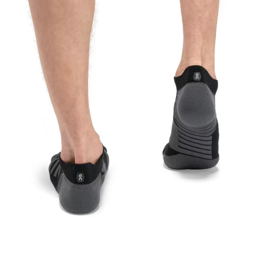 Back view on model of On Performance Low sock for men.