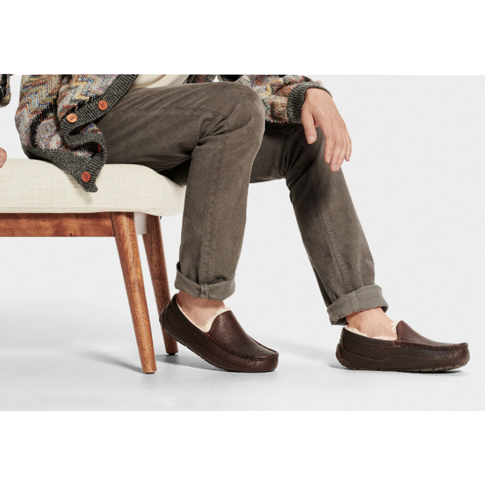 Model view of Ugg Leather Moccasin Slipper.